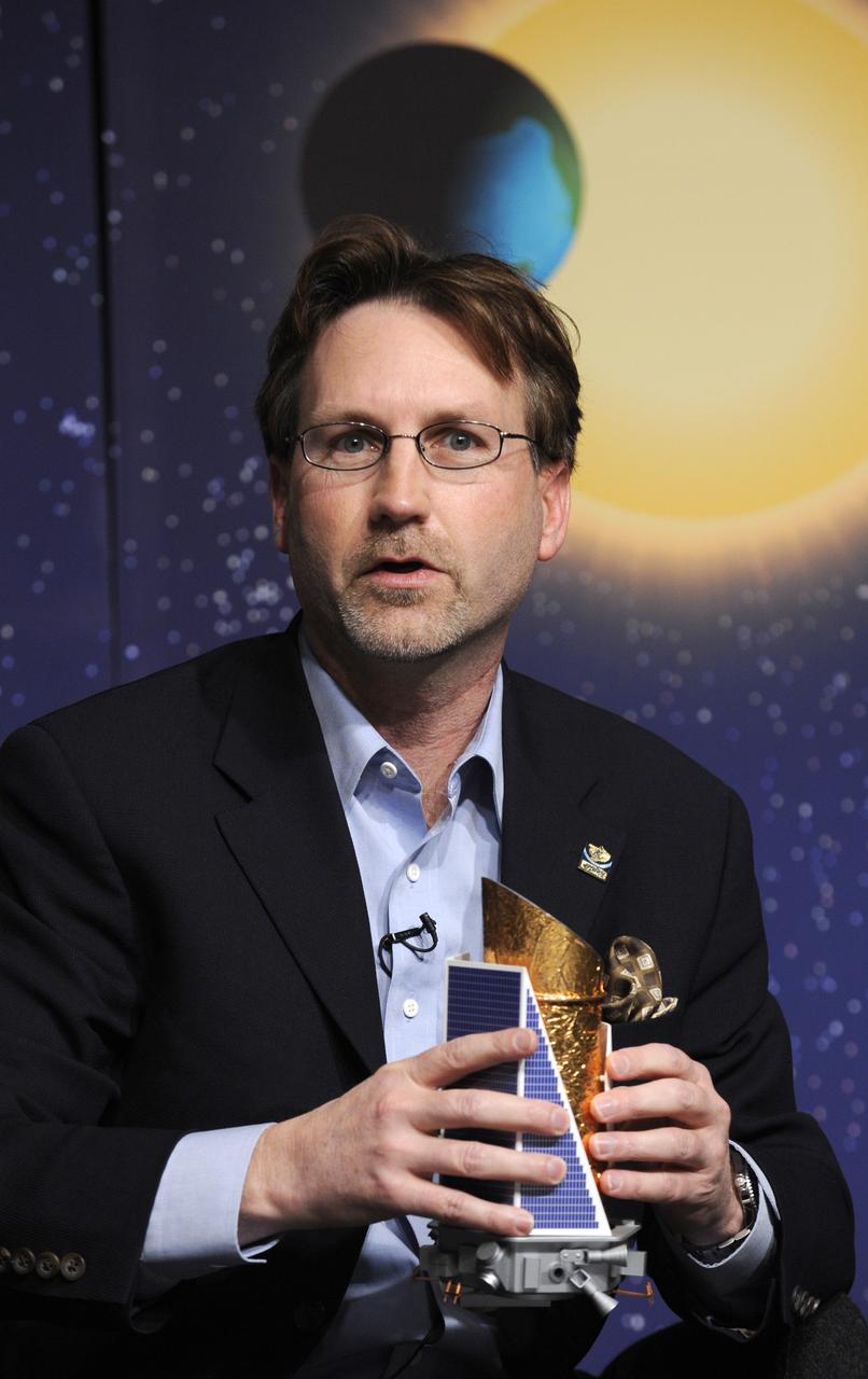 Jim Fanson, Kepler project manager, at NASA's Jet Propulsion Laboratory in Pasadena, Calif. holds a model of the Kepler spacecraft as he talks about the Kepler mission during a media briefing, Thursday, Feb. 19, 2008, at NASA Headquarters in Washington. Kepler, the first mission with the ability to find planets like earth, is scheduled to launch on March 5, 2009 from Cape Canaveral Air Force Station, Fla. aboard a Delta II rocket.  Photo Credit: (NASA/Paul. E. Alers)