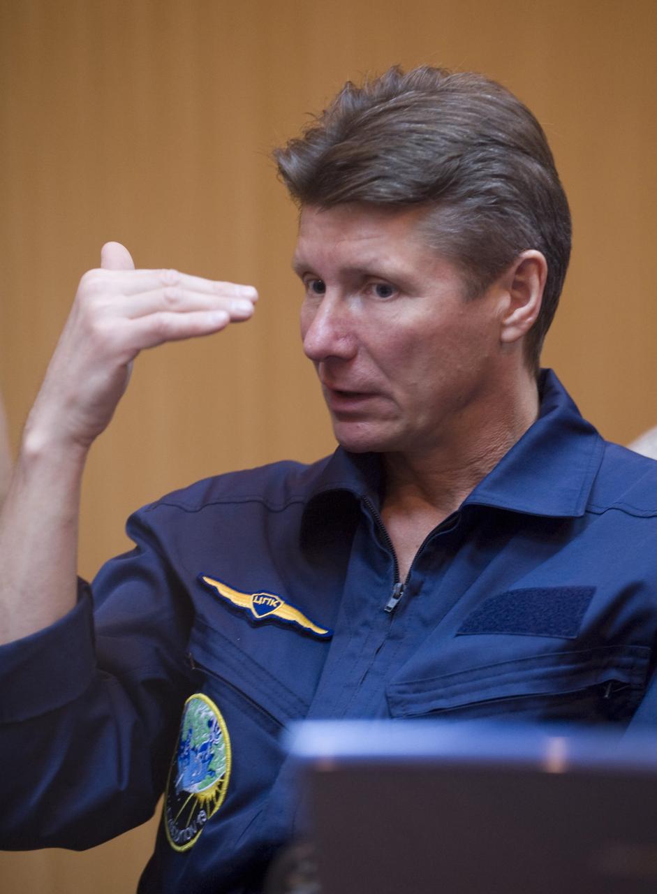 Expedition 19 Commander Gennady I. Padalka is seen through a quarantine windowed room as he and other crew memebers participate in Soyuz rendezvous and docking training at the Cosmonaut Hotel, Saturday, March 21, 2009 in Baikonur, Kazakhstan. (Photo Credit: NASA/Bill Ingalls)
