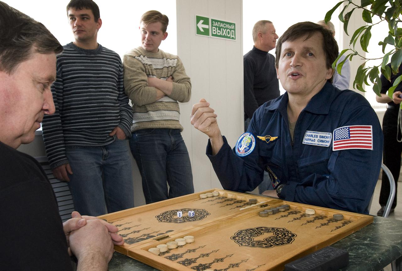 Spaceflight Participant Charles Simonyi plays a game of backgammon at the Cosmonaut Hotel, Saturday, March 21, 2009 in Baikonur, Kazakhstan. (Photo Credit: NASA/Bill Ingalls)