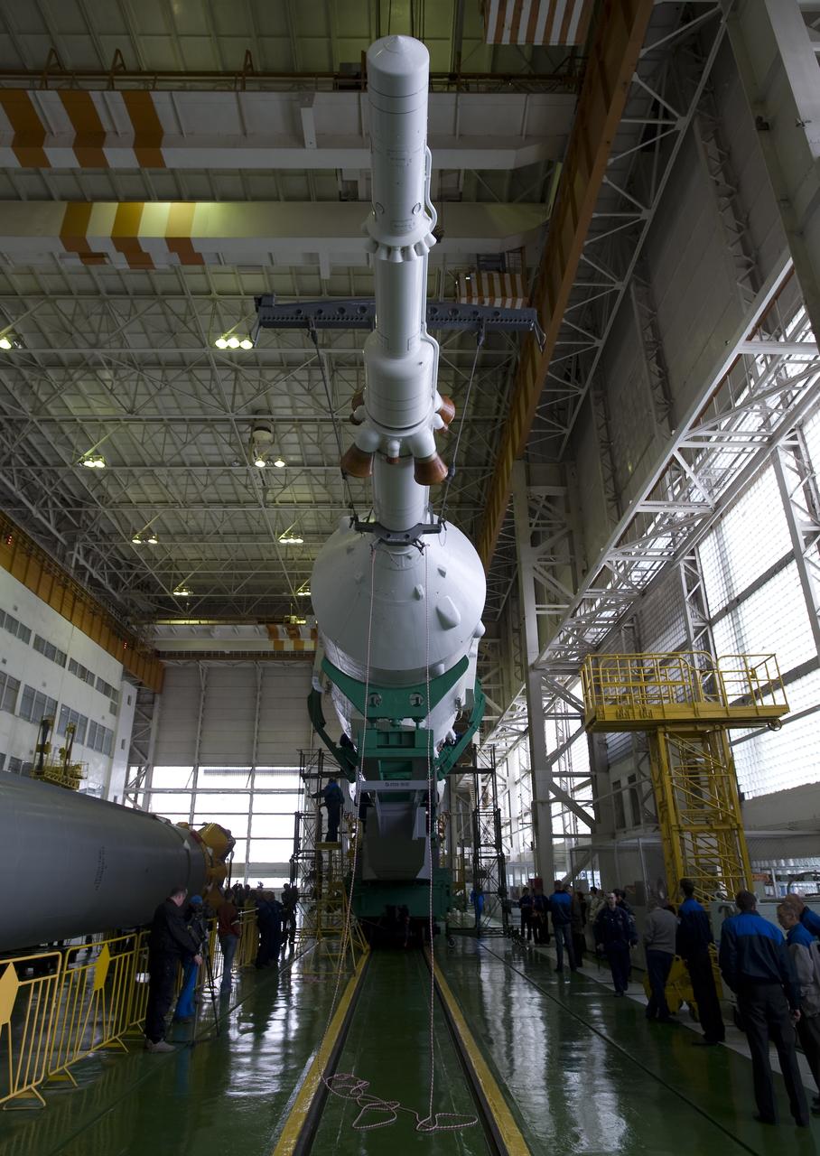 The Soyuz TMA-14 spacecraft, escape tower, first, second and third stages are seen after final assembly Monday, March 23, 2009 at the Baikonur Cosmodrome in Kazakhstan. The Soyuz is scheduled to launch the crew of Expedition 19 and a spaceflight participant on March 26, 2009. Photo Credit: (NASA/Bill Ingalls)