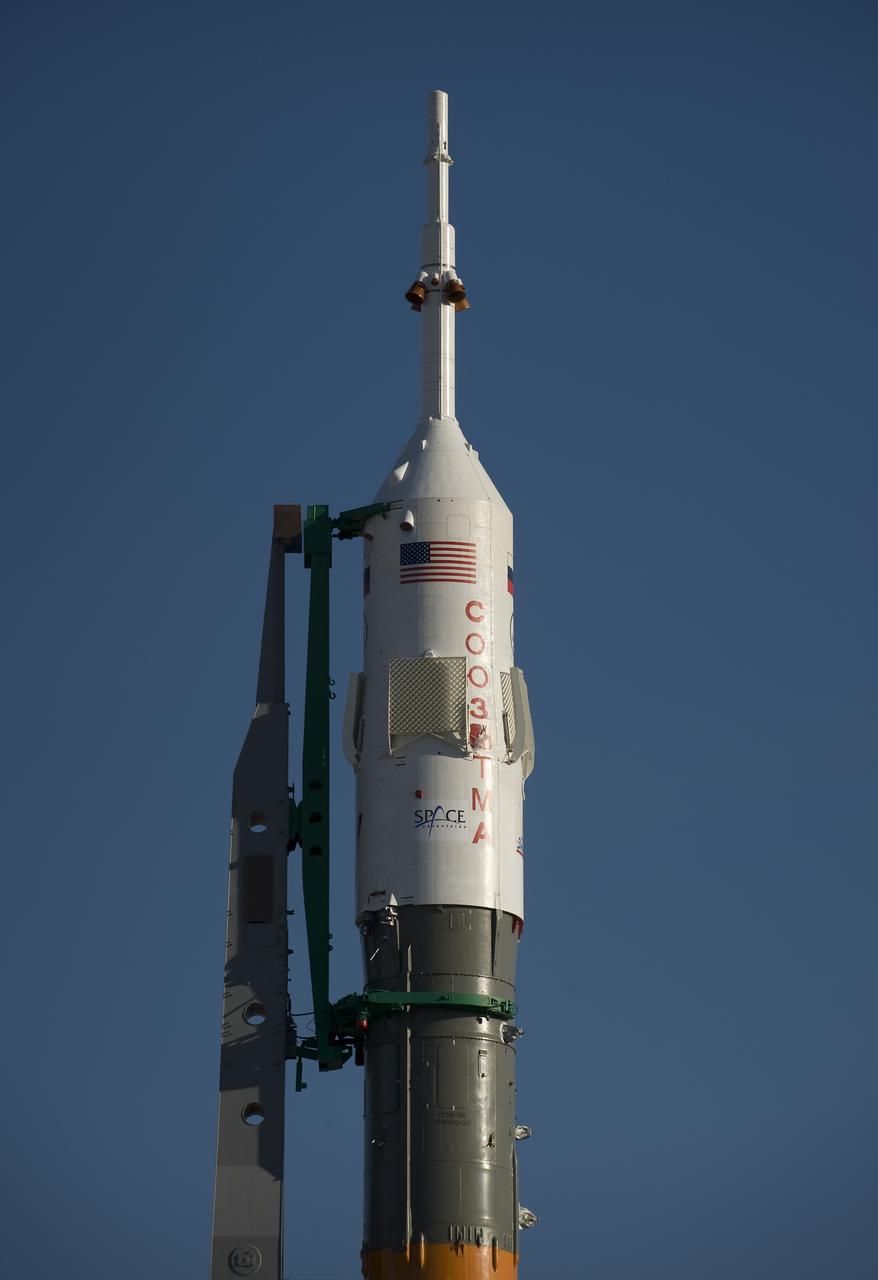 The Soyuz rocket is erected into position at the launch pad Tuesday, March 24, 2009 at the Baikonur Cosmodrome in Kazakhstan. The Soyuz is scheduled to launch the crew of Expedition 19 and a spaceflight participant on March 26, 2009. Photo Credit: (NASA/Bill Ingalls)