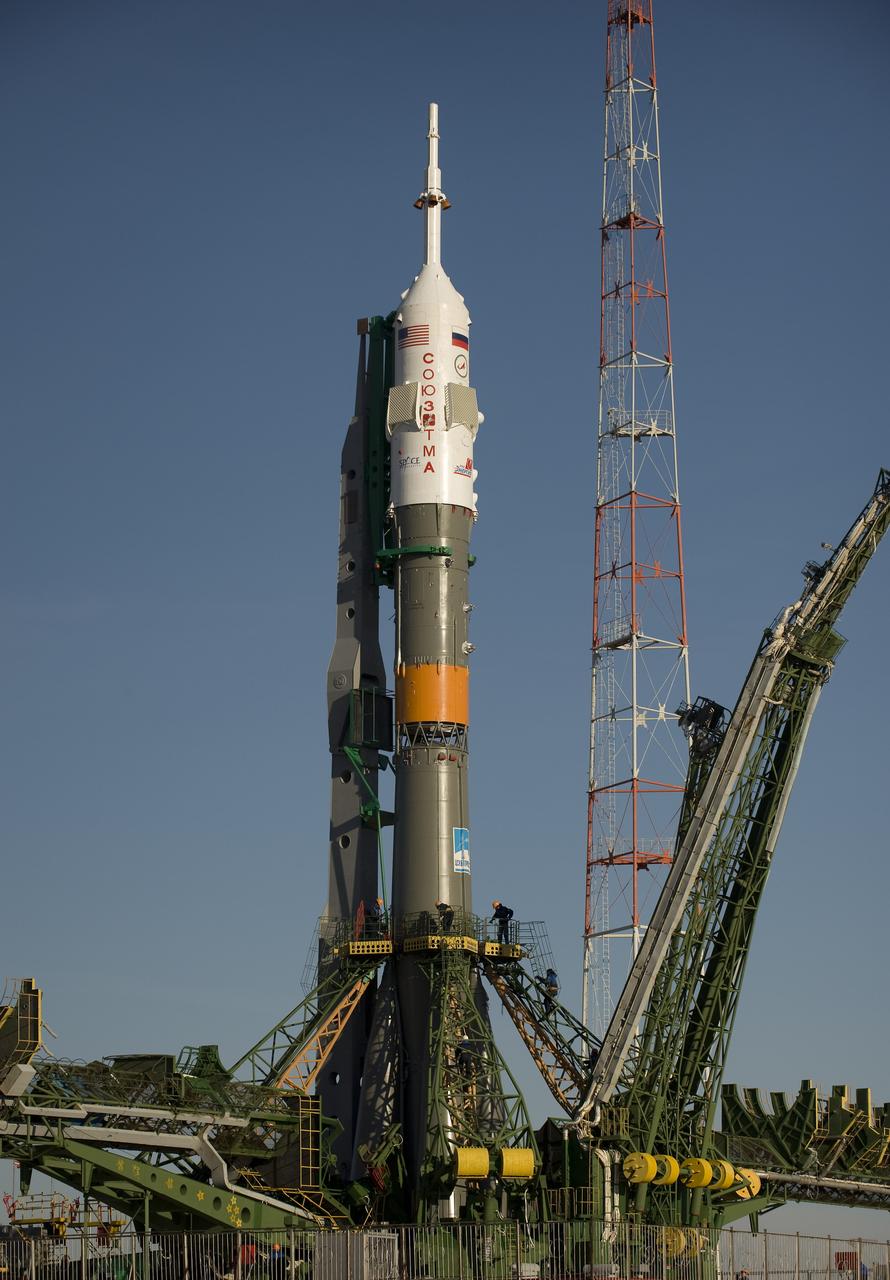 The Soyuz rocket is erected into position at the launch pad Tuesday, March 24, 2009 at the Baikonur Cosmodrome in Kazakhstan. The Soyuz is scheduled to launch the crew of Expedition 19 and a spaceflight participant on March 26, 2009. Photo Credit: (NASA/Bill Ingalls)