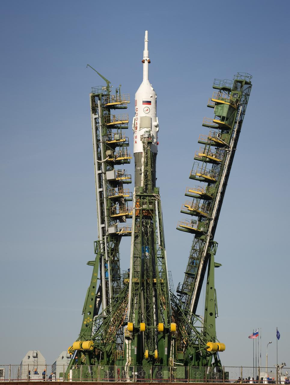 The Soyuz rocket is erected into position at the launch pad Tuesday, March 24, 2009 at the Baikonur Cosmodrome in Kazakhstan.  The Soyuz is scheduled to launch the crew of Expedition 19 and a spaceflight participant on March 26, 2009.  Photo Credit: (NASA/Bill Ingalls)