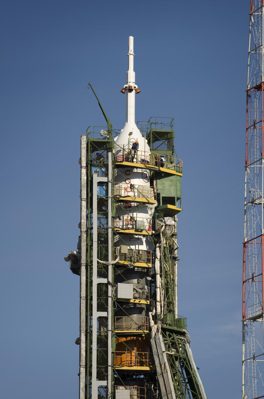 The Soyuz rocket is erected into position at the launch pad Tuesday, March 24, 2009 at the Baikonur Cosmodrome in Kazakhstan. The Soyuz is scheduled to launch the crew of Expedition 19 and a spaceflight participant on March 26, 2009. Photo Credit: (NASA/Bill Ingalls)
