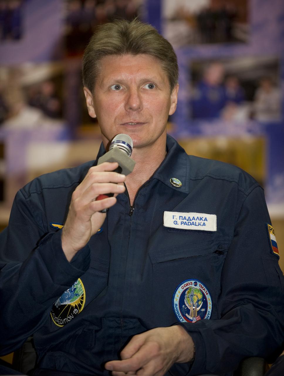 Expedition 19 Commander Gennady I. Padalka answers questions from behind glass during a press conference on Wednesday, March 25, 2009 at the Cosmonaut Hotel in Baikonur, Kazakhstan.  Photo Credit: (NASA/Bill Ingalls)