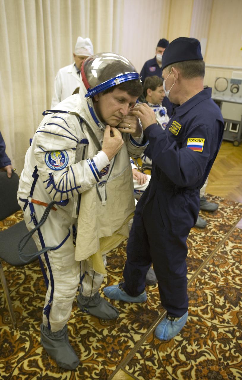 Spaceflight Participant Charles Simonyi dons his Russian Sokol suit in preparation for his Soyuz launch to the International Space Station with Expedition 19 Commander Gennady I. Padalka and Flight Engineer Michael R. Barratt on Thursday, March 26, 2009 in Baikonur, Kazakhstan. (Photo Credit: NASA/Bill Ingalls)