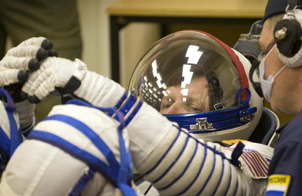 Spaceflight Participant Charles Simonyi has his Russian Sokol suit pressure checked in preparation for his Soyuz launch to the International Space Station with Expedition 19 Commander Gennady I. Padalka and Expedition 19 Flight Engineer Michael R. Barratt on Thursday, March 26, 2009 in Baikonur, Kazakhstan. (Photo Credit: NASA/Bill Ingalls)