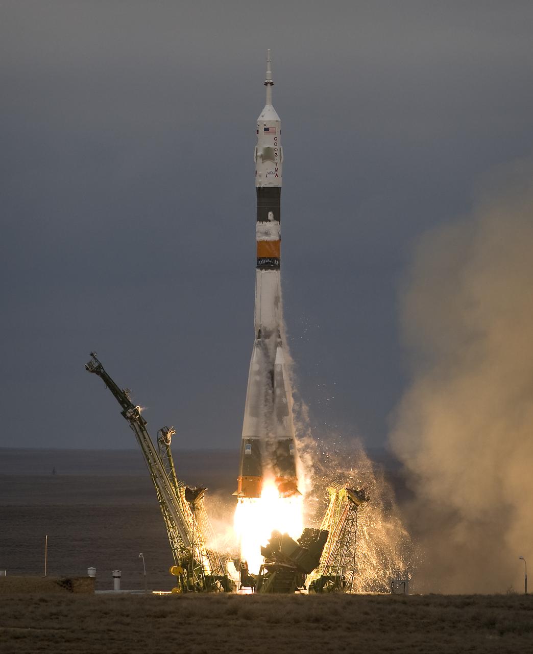 The Soyuz TMA-14 launches from the Baikonur Cosmodrome in Kazakhstan on Thursday, March 26, 2009 carrying Expedition 19 Commander Gennady I. Padalka, Flight Engineer Michael R. Barratt and Spaceflight Participant Charles Simonyi to the International Space Station. (Photo Credit: NASA/Bill Ingalls)