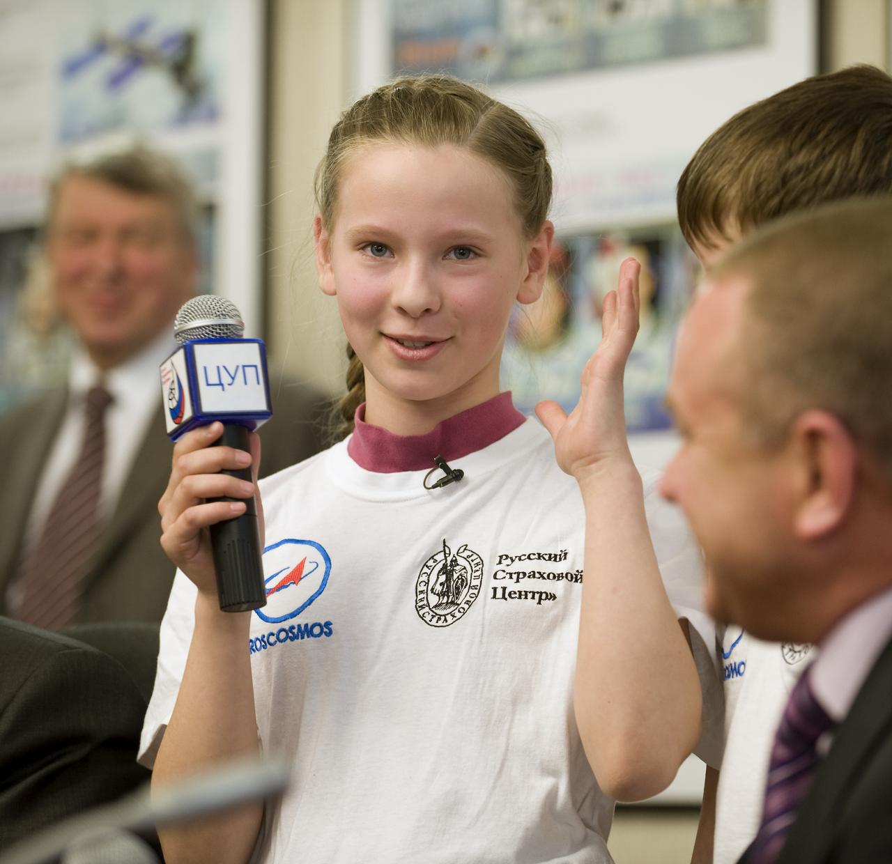 12-year-old Anna Chibiskova of Moscow speaks during the Soyuz post-docking press conference at the Russian mission Control Center in Korolev, Russia on Saturday March 28, 2009. Chibiskova was the winner of an International logo design contest for the Expedition 19 mission. Stas Pyatkin, (not pictured) from the Uglegorsk Amur region, won third place and 12-year-old Keytlin Riley (not pictured) from New York won second place. Photo Credit: (NASA/Bill Ingalls)