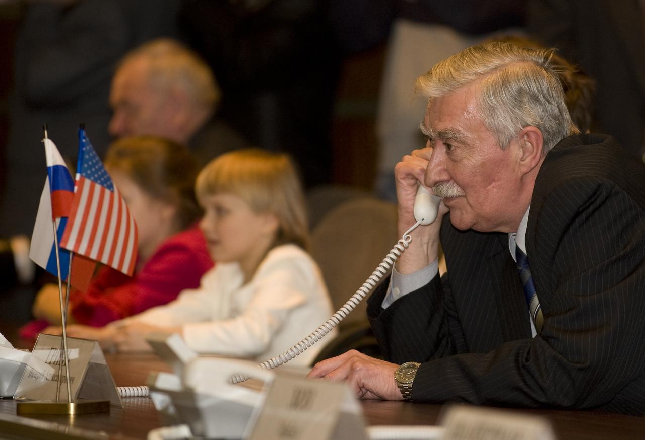 Valery Grin, Deputy Head of State Commission, talks on the phone to the six crew members onboard the International Space Station from the Russian Mission Control Center, Korolev, Russia, Saturday, March 28, 2009. The Soyuz TMA-14 spacecraft docked to the International Space Station and delivered Expedition 19 Commander Gennady I. Padalka, Flight Engineer Michael R. Barratt and Spaceflight Participant Charles Simonyi. Photo Credit: (NASA/Bill Ingalls)
