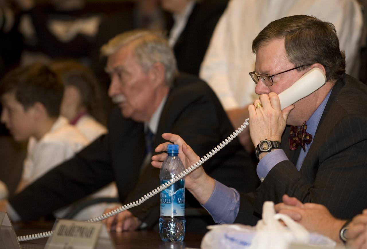 Mike Hawes, NASA's Acting Associate Administrator, talks on the phone to the six crew members onboard the International Space Station from the Russian Mission Control Center, Korolev, Russia, Saturday, March 28, 2009. The Soyuz TMA-14 spacecraft docked to the International Space Station and delivered Expedition 19 Commander Gennady I. Padalka, Flight Engineer Michael R. Barratt and Spaceflight Participant Charles Simonyi. Photo Credit: (NASA/Bill Ingalls)