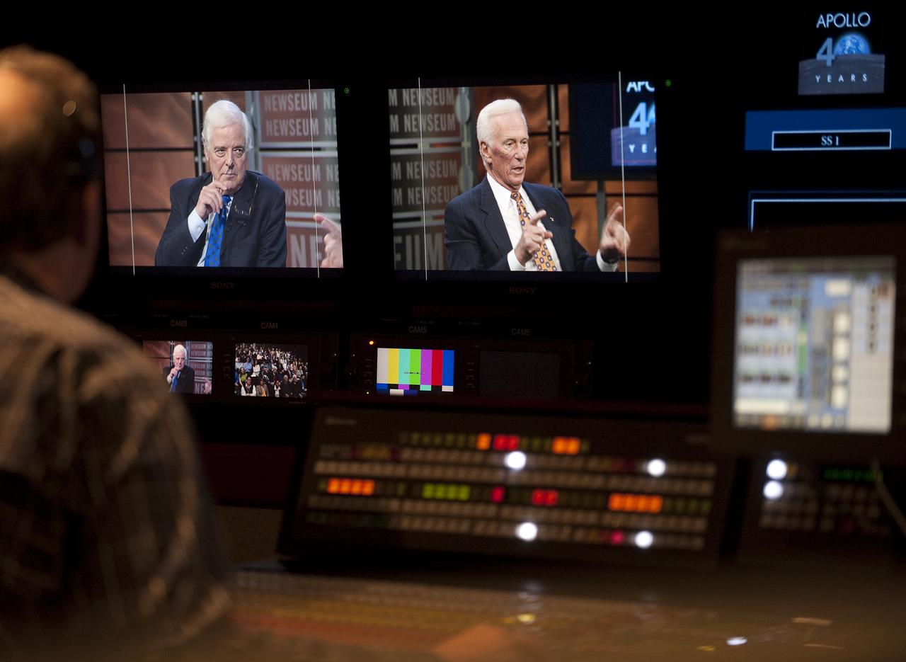 In this image made inside the TV production studio of the Newseum, NASA Apollo 10 Astronaut Gene Cernan, right monitor, answers questions from the Newseum's distinguished journalist-in-residence, Nick Clooney, left monitor, during a Newseum TV program celebrating the 40th anniversary of Apollo 10, Monday, May 18, 2009, in Washington.  Photo Credit (NASA/Bill Ingalls)
