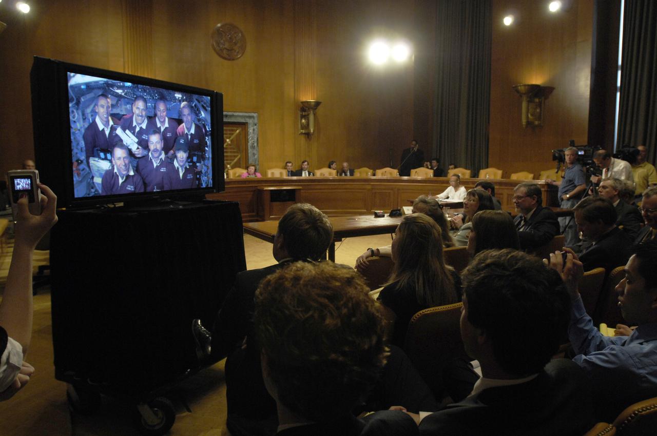 U.S. Sen. Barbara Mikulski, D-Md., rear right, speaks to the crew of STS-125, during a televised phone call to the space shuttle, Thursday, May 21, 2009, in a Dirksen Senate office building hearing room on Capitol Hill in Washington. The crew of STS-125 is returning to earth after finishing repairs on the Hubble Space Telescope. Photo Credit: (NASA/Paul E. Alers)