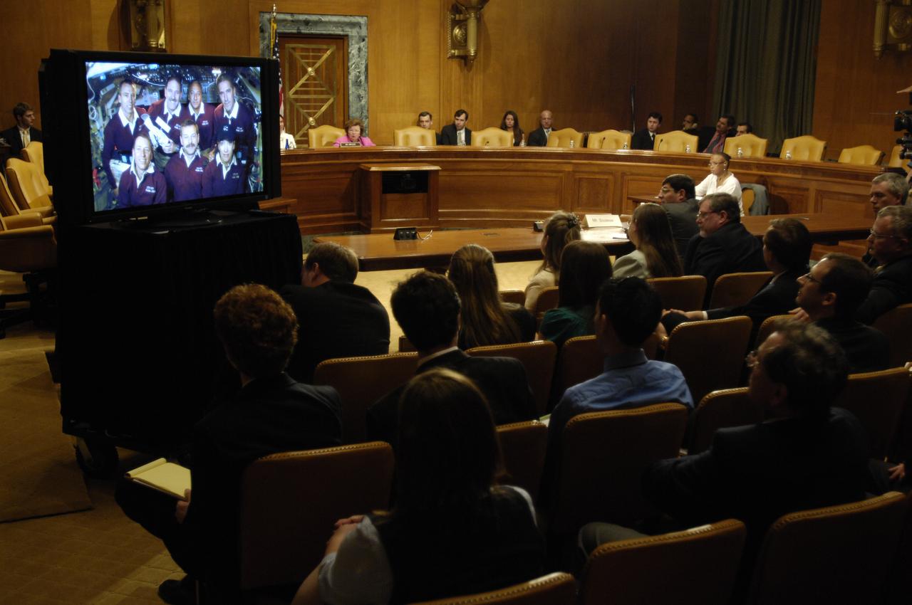 U.S. Sen. Barbara Mikulski, D-Md., rear right, speaks to the crew of STS-125, during a televised phone call to the space shuttle, Thursday, May 21, 2009, in a Dirksen Senate office building hearing room on Capitol Hill in Washington. The crew of STS-125 is returning to earth after finishing repairs on the Hubble Space Telescope. Photo Credit: (NASA/Paul E. Alers)