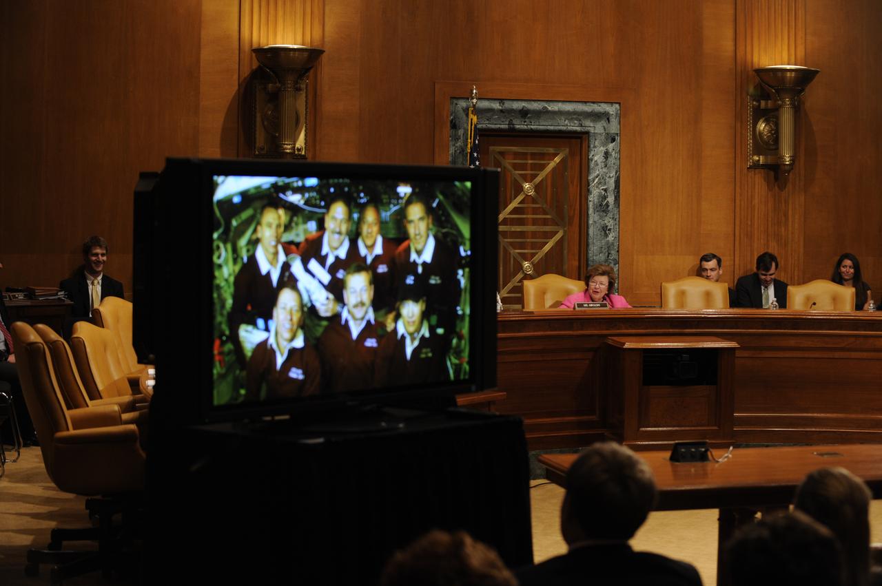 U.S. Sen. Barbara Mikulski, D-Md., rear right, speaks to the crew of STS-125, during a televised phone call to the space shuttle, Thursday, May 21, 2009, in a Dirksen Senate office building hearing room on Capitol Hill in Washington. The crew of STS-125 is returning to earth after finishing repairs on the Hubble Space Telescope. Photo Credit: (NASA/Paul E. Alers)