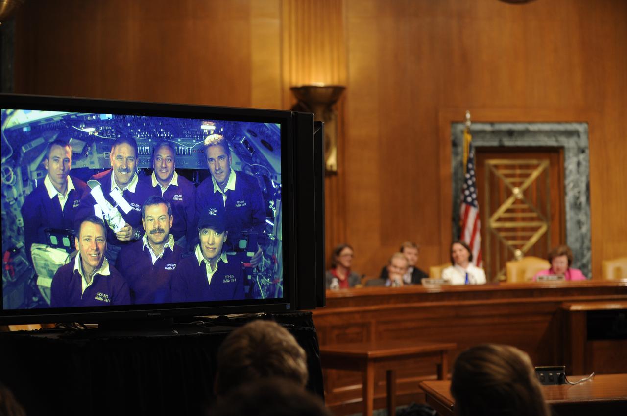 U.S. Sen. Barbara Mikulski, D-Md., rear right, along with Sen. Bill Nelson, D-Fla., rear left, speak to the crew of STS-125, during a televised phone call to the space shuttle, Thursday, May 21, 2009, in a Dirksen Senate office building hearing room on Capitol Hill in Washington. The crew of STS-125 is returning to earth after finishing repairs on the Hubble Space Telescope. Photo Credit: (NASA/Paul E. Alers)