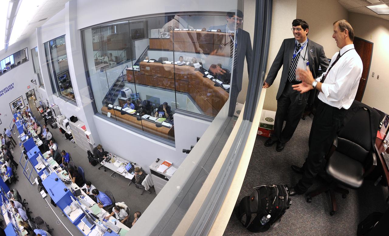 NASA Acting Administrator Chris Scolese, 2nd from right, looks out over the Atlas V Spaceflight Operations Center prior to the launch of the Lunar Reconnaissance Orbiter and Lunar Crater Observation and Sensing Satellite Thursday, June 18, 2009, from Cape Canaveral Air Force Station, Florida. Photo Credit: (NASA/Bill Ingalls)