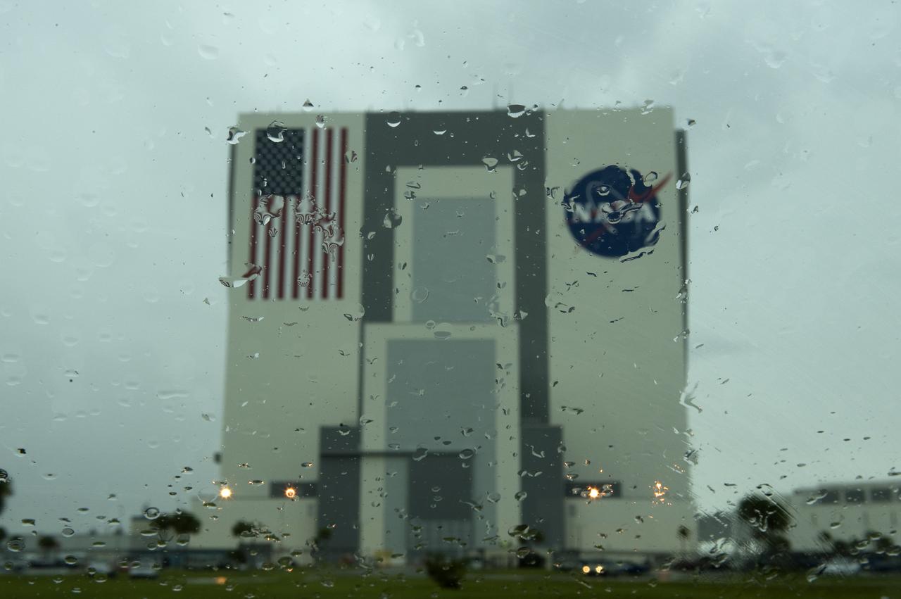The NASA Vehicle Assembly Building is seen through a rain covered windshield at NASA's Kennedy Space Center in Florida on Friday, July 10, 2009. NASA is set to launch the space shuttle Endeavour with the crew of STS-127 on Saturday. Photo Credit: (NASA/Bill Ingalls)