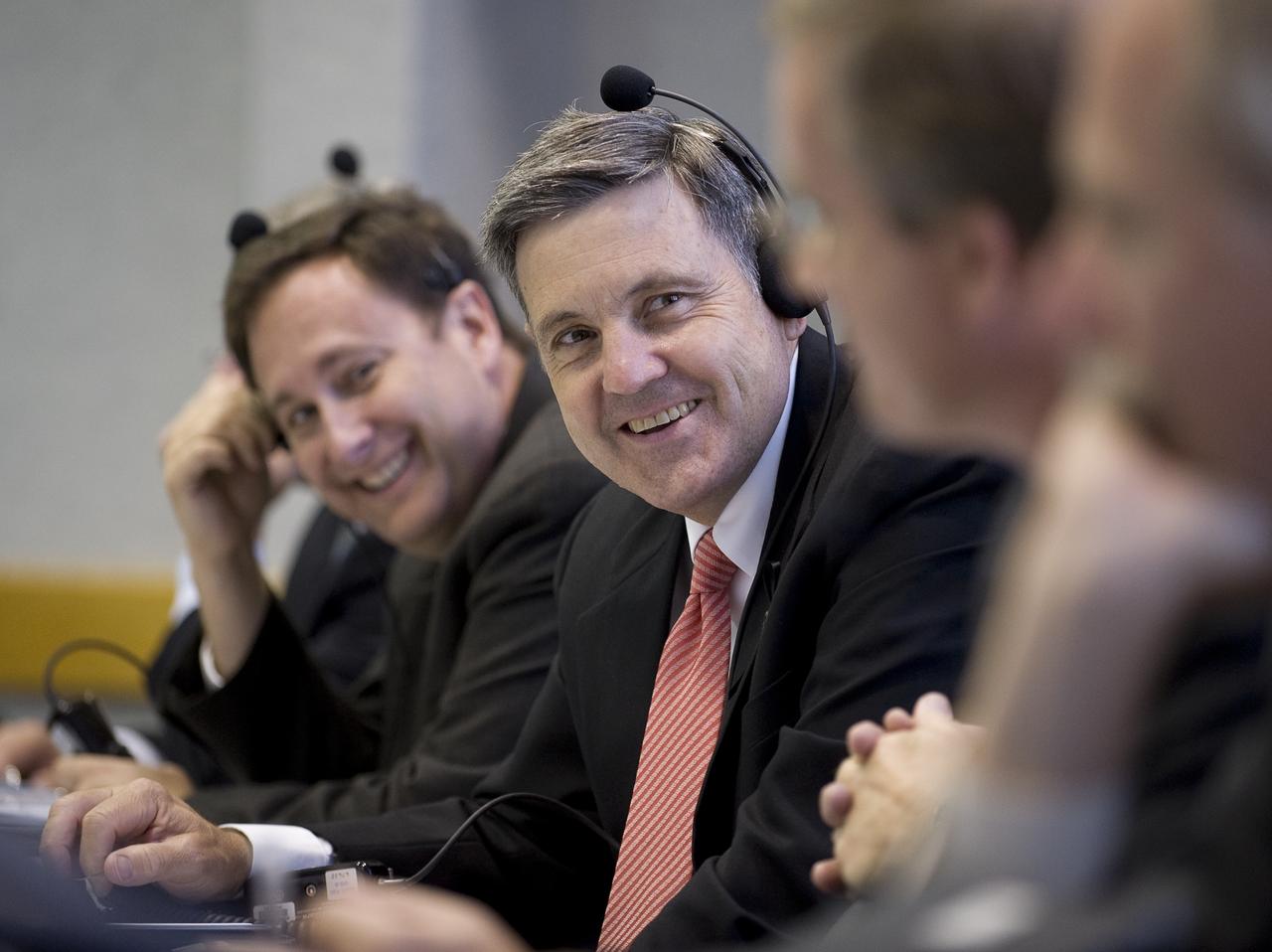 Bob Cabana, Director of NASA's Kennedy Space Center talks with other mission managers in Firing Room Four of the Launch Control Center at NASA's Kennedy Space Center in Cape Canaveral, Florida, Sunday, July 12, 2009. Endeavour is set to launch at 7:13p.m. EDT with the crew of STS-127 and start a 16-day mission that will feature five spacewalks and complete construction of the Japan Aerospace Exploration Agency's Kibo laboratory. Photo Credit: (NASA/Bill Ingalls)