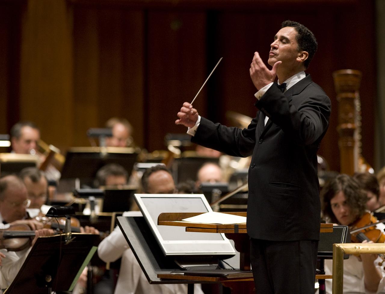Emil de Cou conducts the National Symphony Orchestra during the "Salute to Apollo" ceremony at the Kennedy Center for the Performing Arts, Saturday, July 18, 2009 in Washington. The event was part of NASA's week long celebration of the Apollo 40th Anniversary. Photo Credit: (NASA/Bill Ingalls)