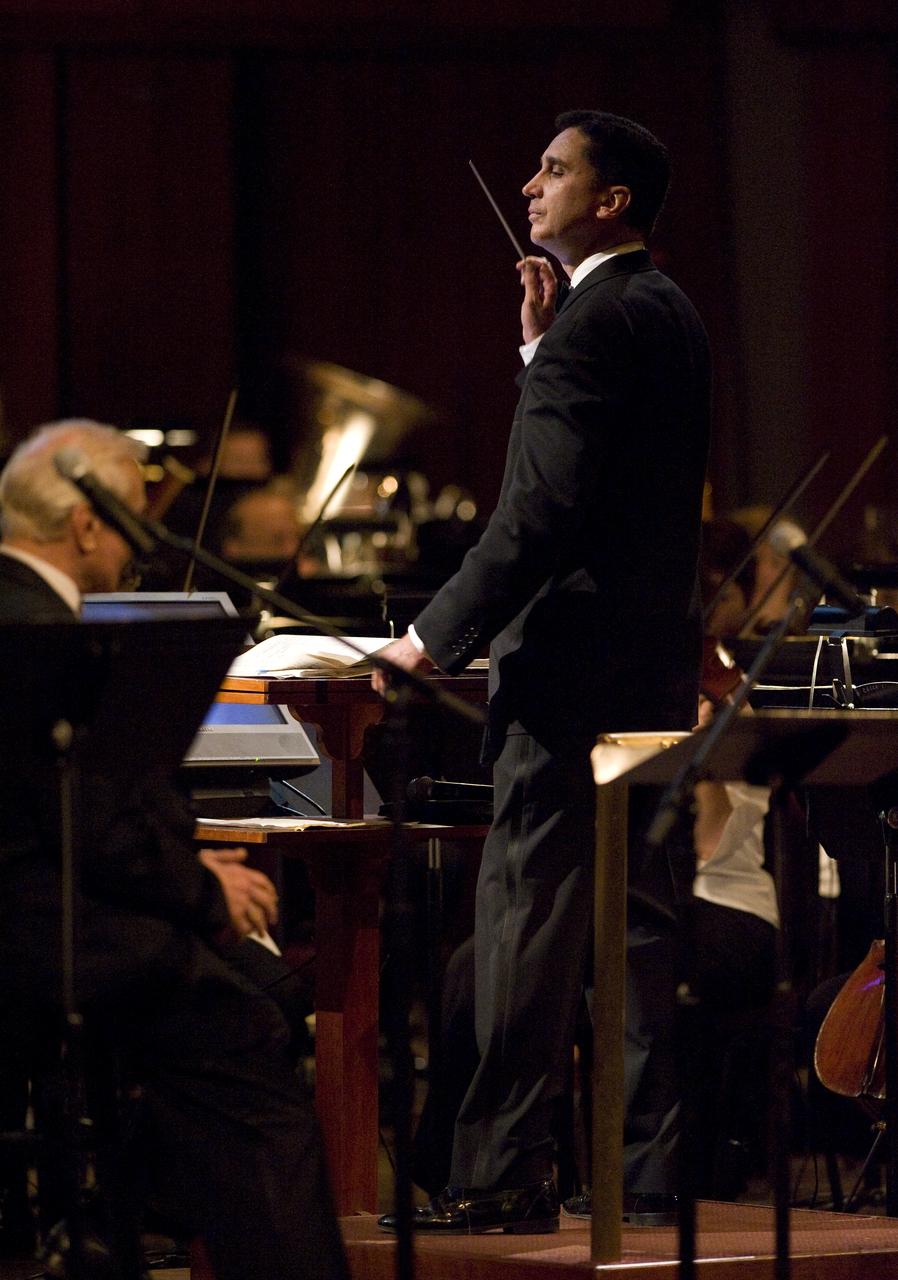 Emil de Cou conducts the National Symphony Orchestra during the "Salute to Apollo" ceremony at the Kennedy Center for the Performing Arts, Saturday, July 18, 2009 in Washington. The event was part of NASA's week long celebration of the Apollo 40th Anniversary. Photo Credit: (NASA/Bill Ingalls)