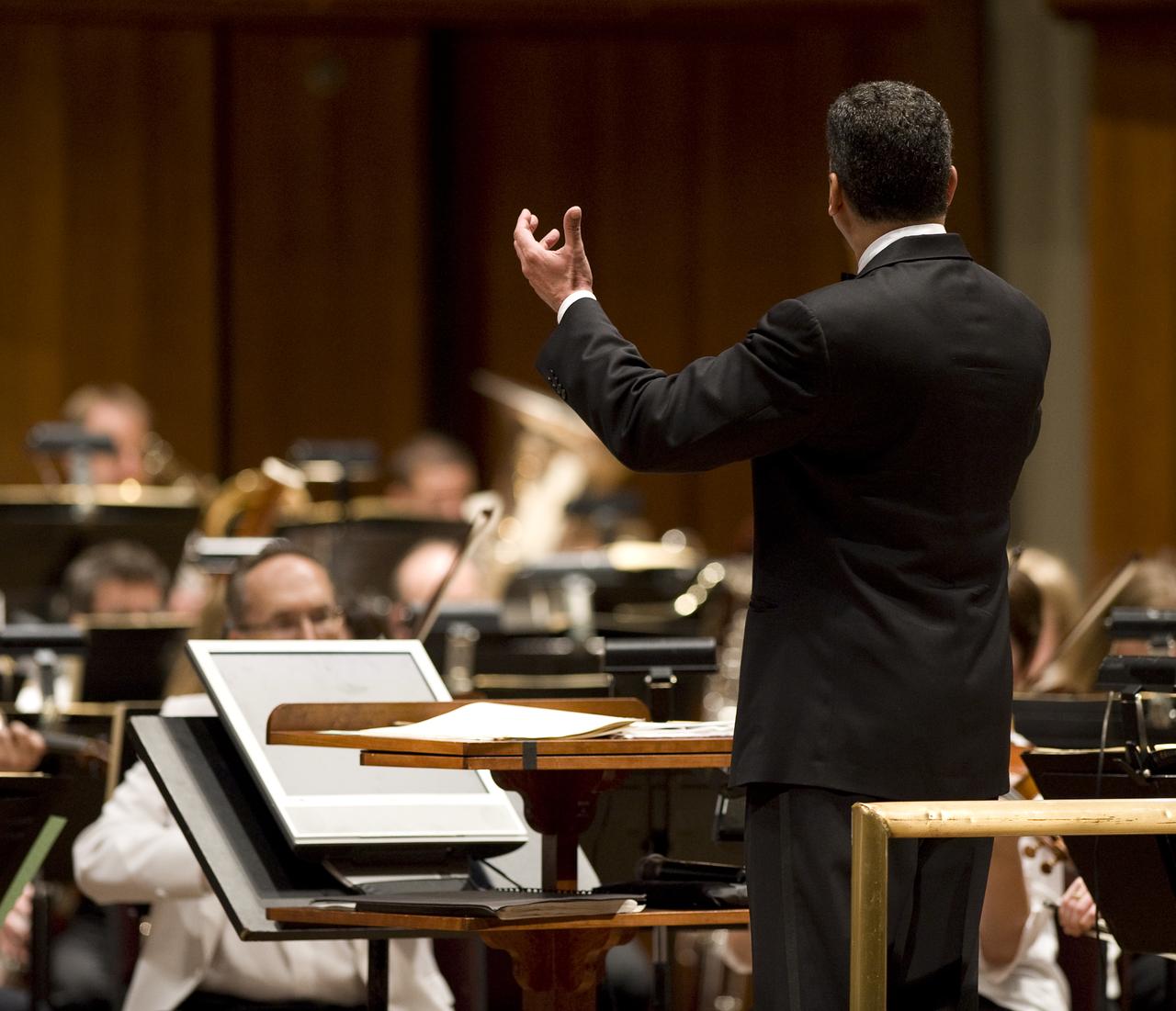 Emil de Cou conducts the National Symphony Orchestra during the "Salute to Apollo" ceremony at the Kennedy Center for the Performing Arts, Saturday, July 18, 2009 in Washington. The event was part of NASA's week long celebration of the Apollo 40th Anniversary. Photo Credit: (NASA/Bill Ingalls)