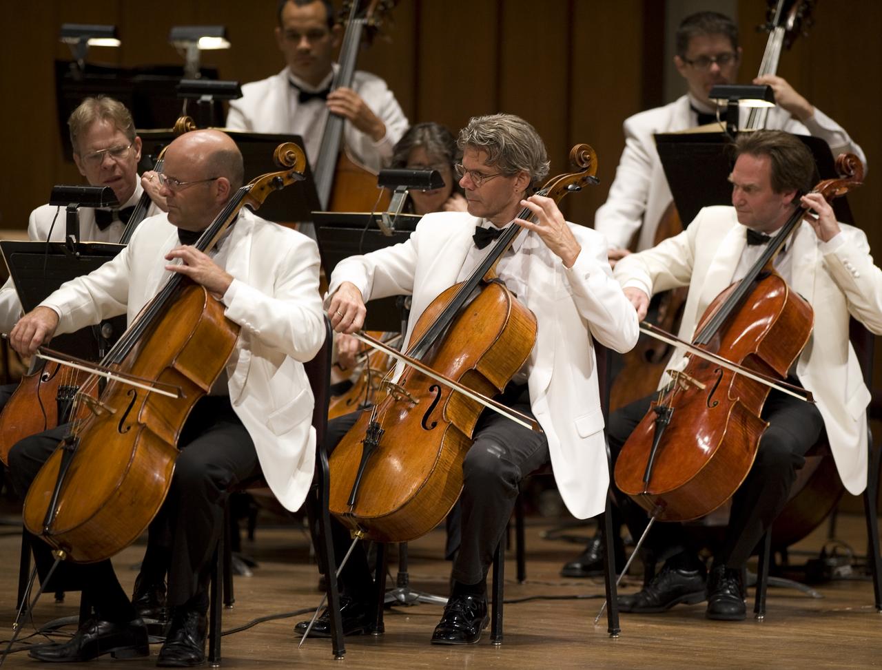 Members of the National Symphony Orchestra, under Conductor Emil de Cou, perform during the "Salute to Apollo" ceremony at the Kennedy Center for the Performing Arts, Saturday, July 18, 2009 in Washington. The event was part of NASA's week long celebration of the Apollo 40th Anniversary. Photo Credit: (NASA/Bill Ingalls)