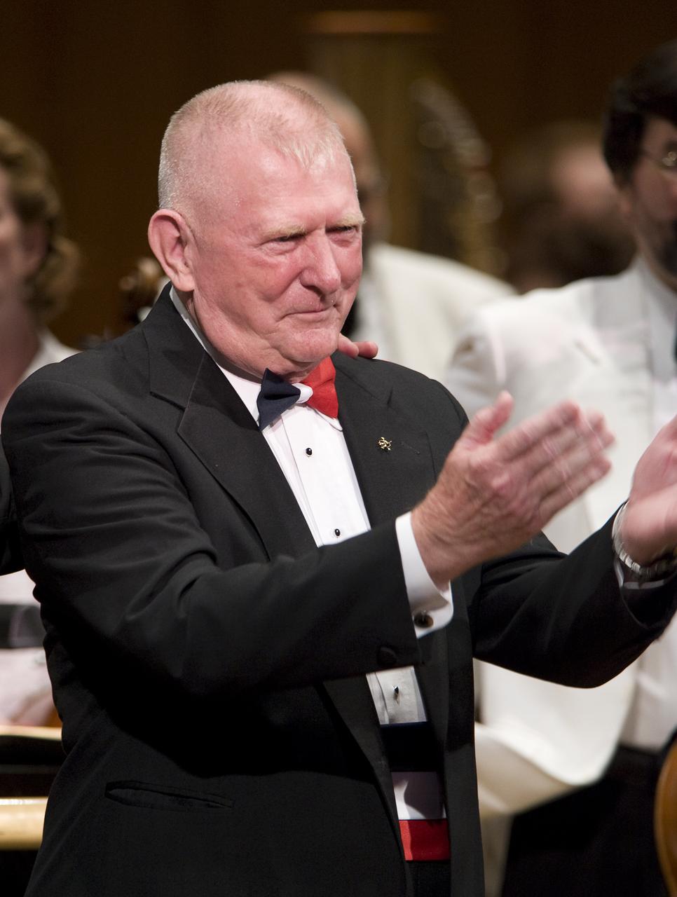 Gene Kranz, retired NASA Flight Director and manager, thanks the audience after having guest conducted of the National Symphony Orchestra during the "Salute to Apollo" ceremony at the Kennedy Center for the Performing Arts, Saturday, July 18, 2009 in Washington. The event was part of NASA's week long celebration of the Apollo 40th Anniversary. Photo Credit: (NASA/Bill Ingalls)