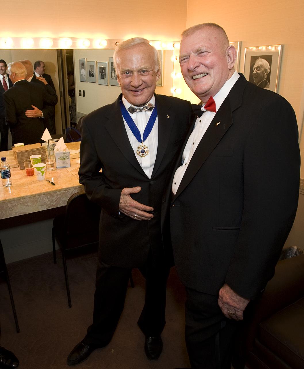 Apollo 11 astronaut Buzz Aldrin, left, meets with Gene Kranz, retired NASA Flight Director and manager, back stage after the "Salute to Apollo" ceremony at the Kennedy Center for the Performing Arts, Saturday, July 18, 2009 in Washington. The event was part of NASA's week long celebration of the Apollo 40th Anniversary. Photo Credit: (NASA/Bill Ingalls)