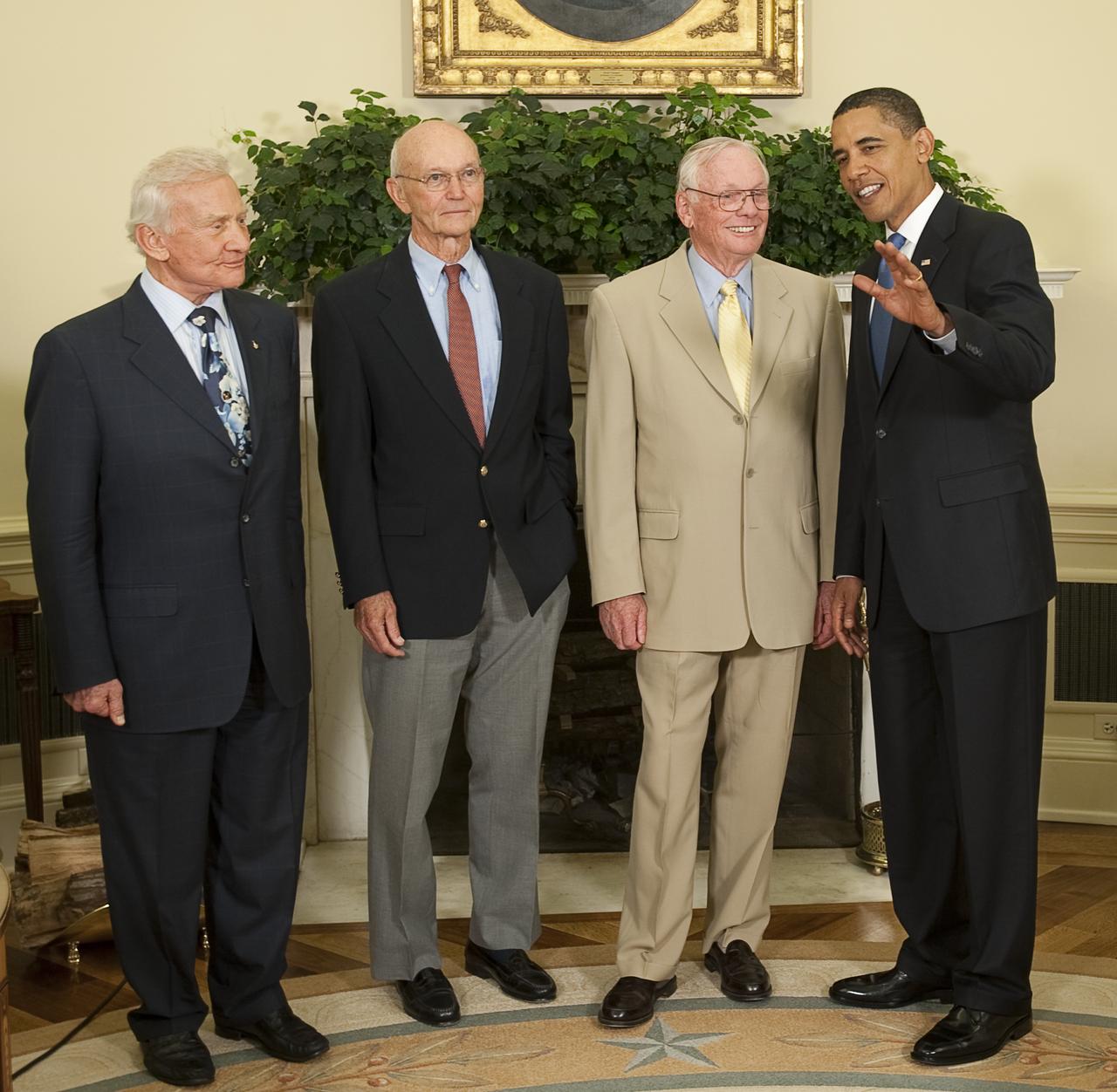 President Barack Obama poses with Apollo 11 astronauts, from left, Buzz Aldrin, Michael Collins, and Neil Armstrong, Monday, July 20, 2009, in the Oval Office of the White House in Washington, on the 40th anniversary of the Apollo 11 lunar landing.  Photo Credit: (NASA/Bill Ingalls)