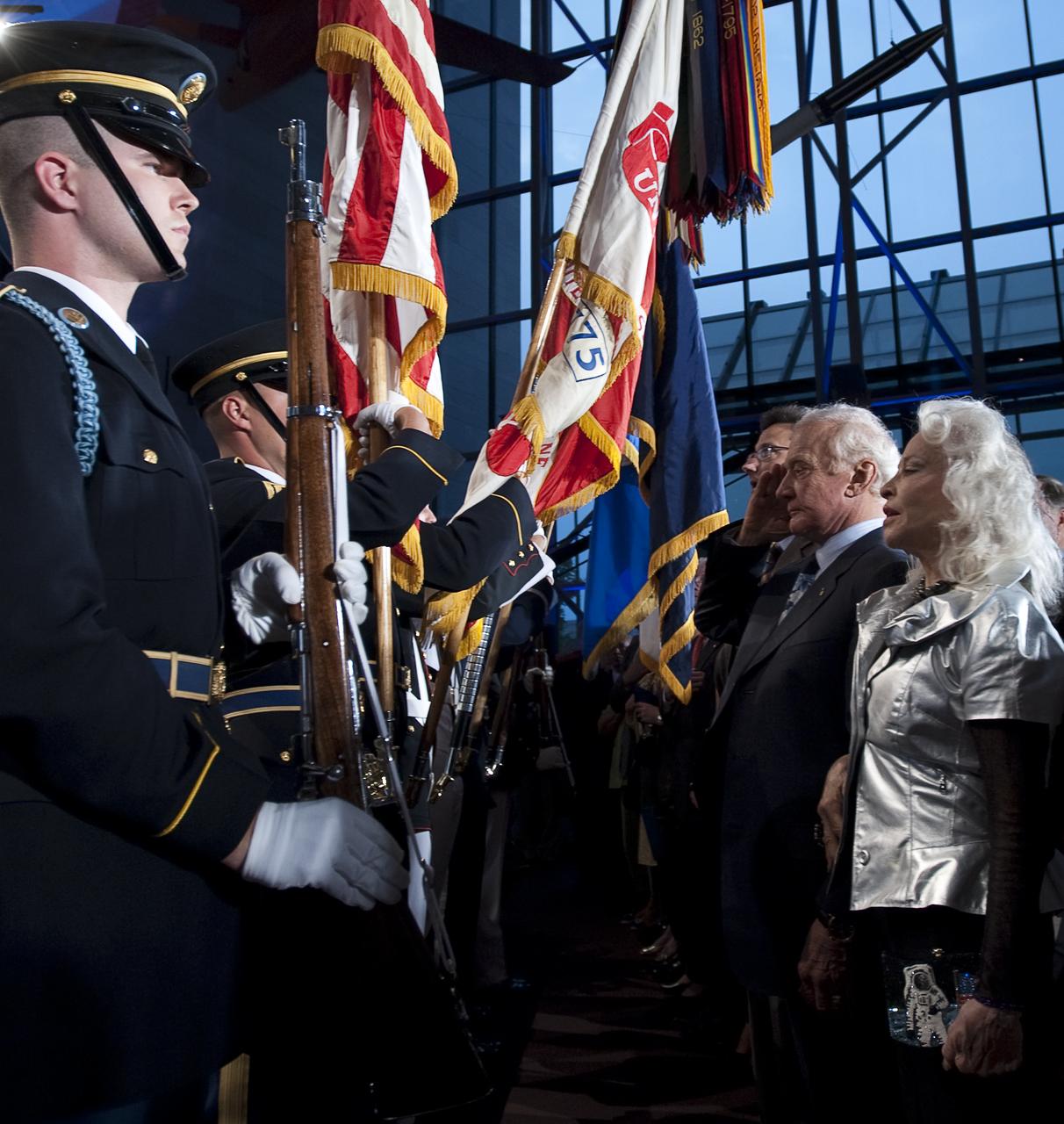 NASA Apollo 11 Astronaut Buzz Aldrin, right, and his wife Lois stand at attention in front of the color guard during the opening of the Apollo 40th anniversary celebration held at the National Air and Space Museum, Monday, July 20, 2009 in Washington. Photo Credit: (NASA/Bill Ingalls)