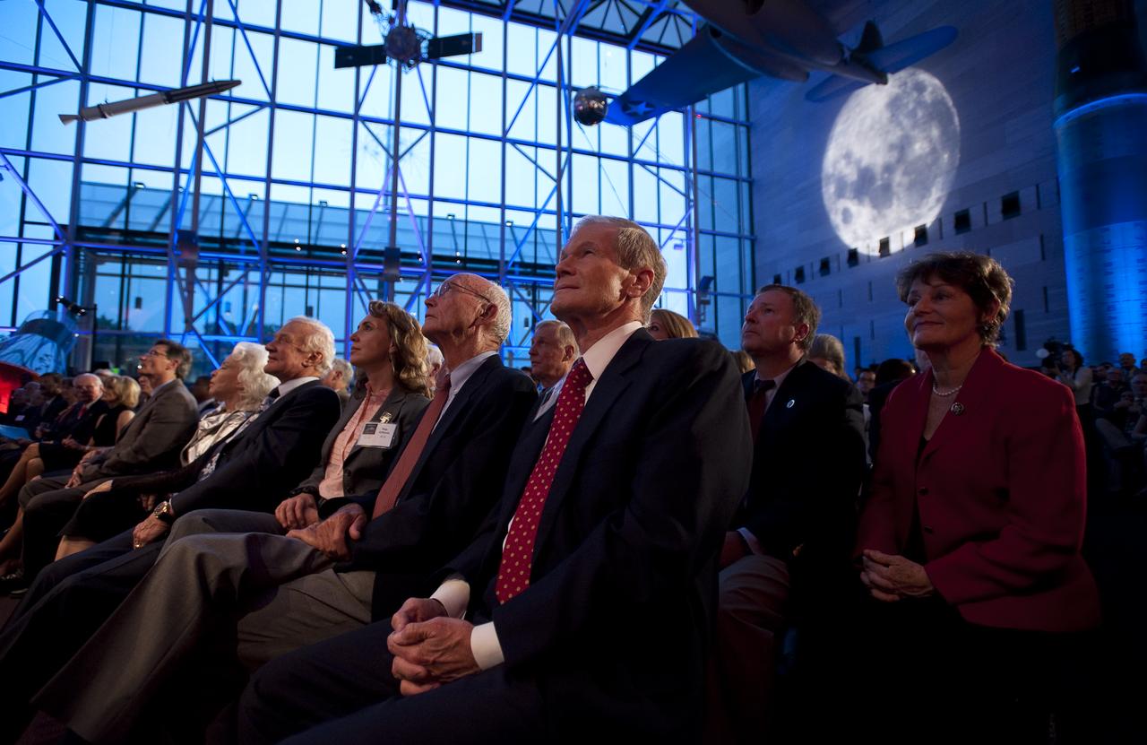 Guest, front row from right, U.S. Senator Bill Nelson (D-FL), Apollo 11 Command Module Pilot Michael Collins, U.S. Congresswoman Gabrielle Giffords (D-AZ), and Apollo 11 Lunar Module Pilot Buzz Aldrin, listen during the Apollo 40th anniversary celebration held at the National Air and Space Museum, Monday, July 20, 2009 in Washington. Photo Credit: (NASA/Bill Ingalls)