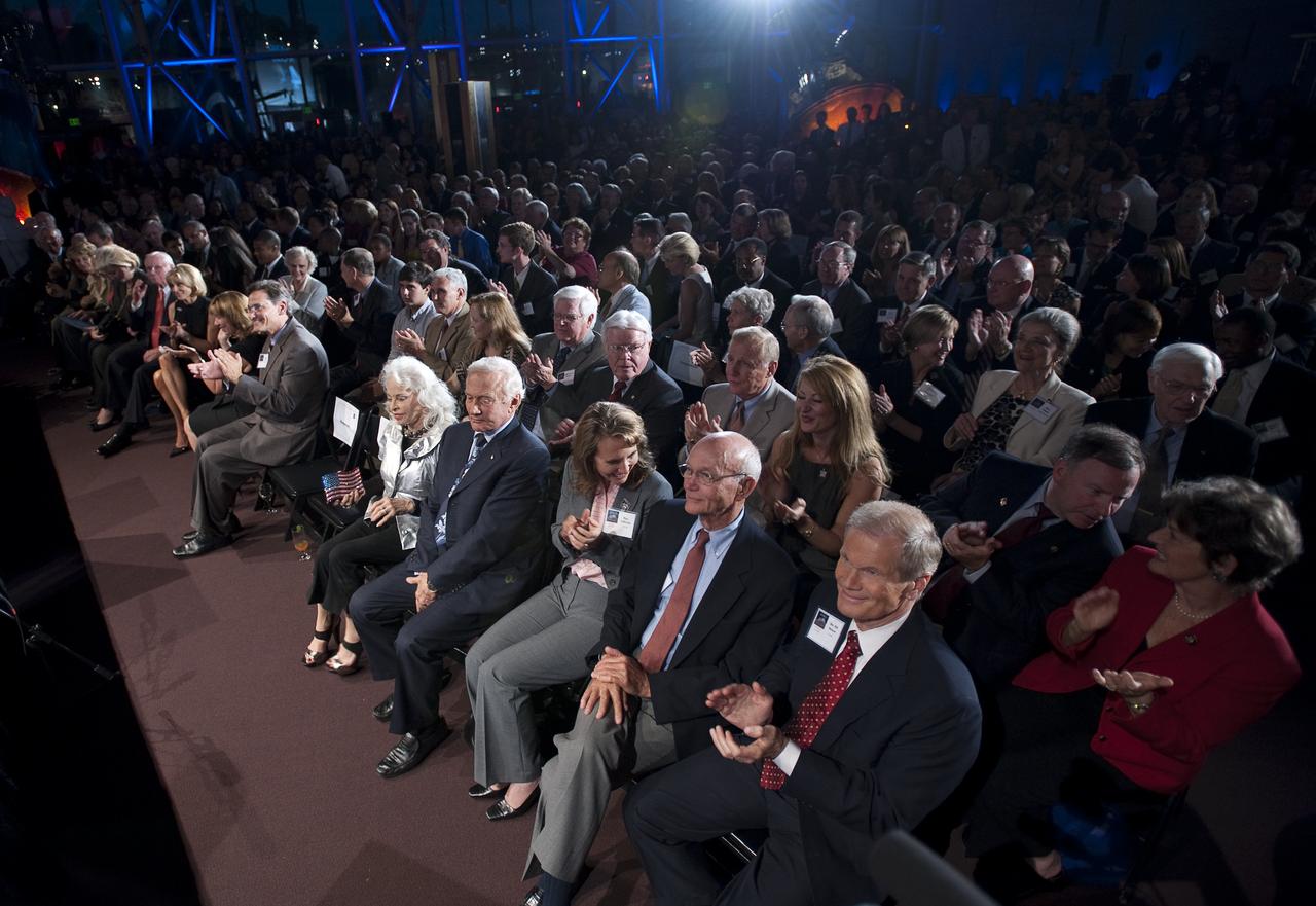 Guest, front row from right, U.S. Senator Bill Nelson (D-FL), Apollo 11 Command Module Pilot Michael Collins, U.S. Congresswoman Gabrielle Giffords (D-AZ), and Apollo 11 Lunar Module Pilot Buzz Aldrin, listen during the Apollo 40th anniversary celebration held at the National Air and Space Museum, Monday, July 20, 2009 in Washington. Photo Credit: (NASA/Bill Ingalls)