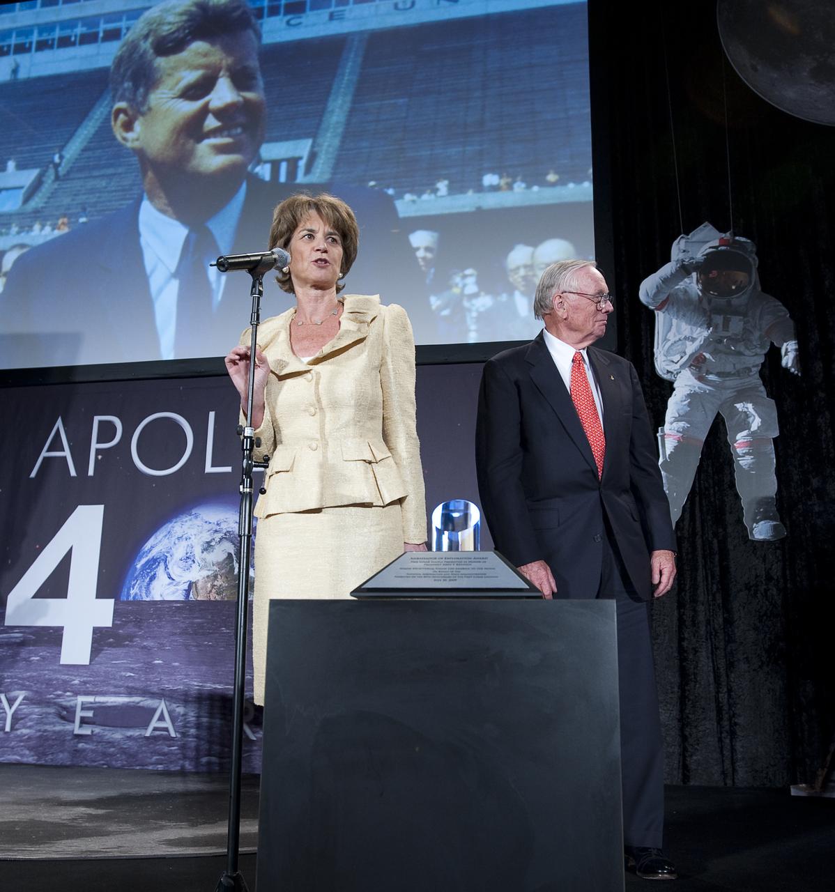 Former Maryland Lieutenant Governor and niece of President John F. Kennedy, Kathleen Kennedy Townsend speaks As Neil Armstrong, Background, and others approach the stage at the Apollo 40th anniversary celebration held at the National Air and Space Museum, Monday, July 20, 2009 in Washington. Photo Credit: (NASA/Bill Ingalls)