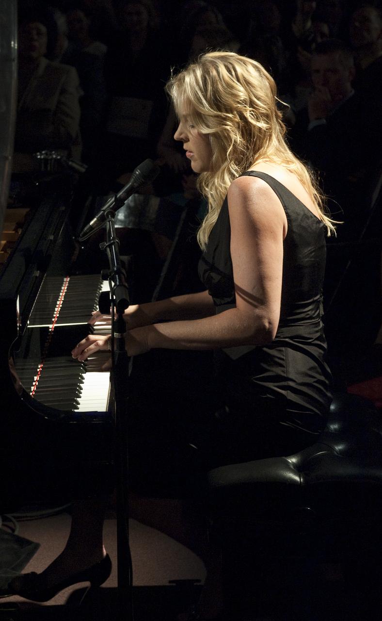 Jazz pianist and singer Diana Krall performs at the Apollo 40th anniversary celebration held at the National Air and Space Museum, Monday, July 20, 2009 in Washington.  Diana Krall talked about her love of space flight and showed off her temporary tattoo that honors Canadian Astronaut Bob Thirsk who is currently onboard the International Space Station. Photo Credit: (NASA/Carla Cioffi)