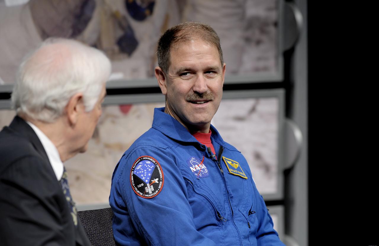 STS-125 Mission Specialist John Grunsfeld, right, talks with host Nick Clooney during a panel discussion, Monday, July 20, 2009, at the Newseum in Washington as part of the commemoration of the 40th Anniversary of the Apollo 11 moon landing. Photo Credit: (NASA/Bill Ingalls)