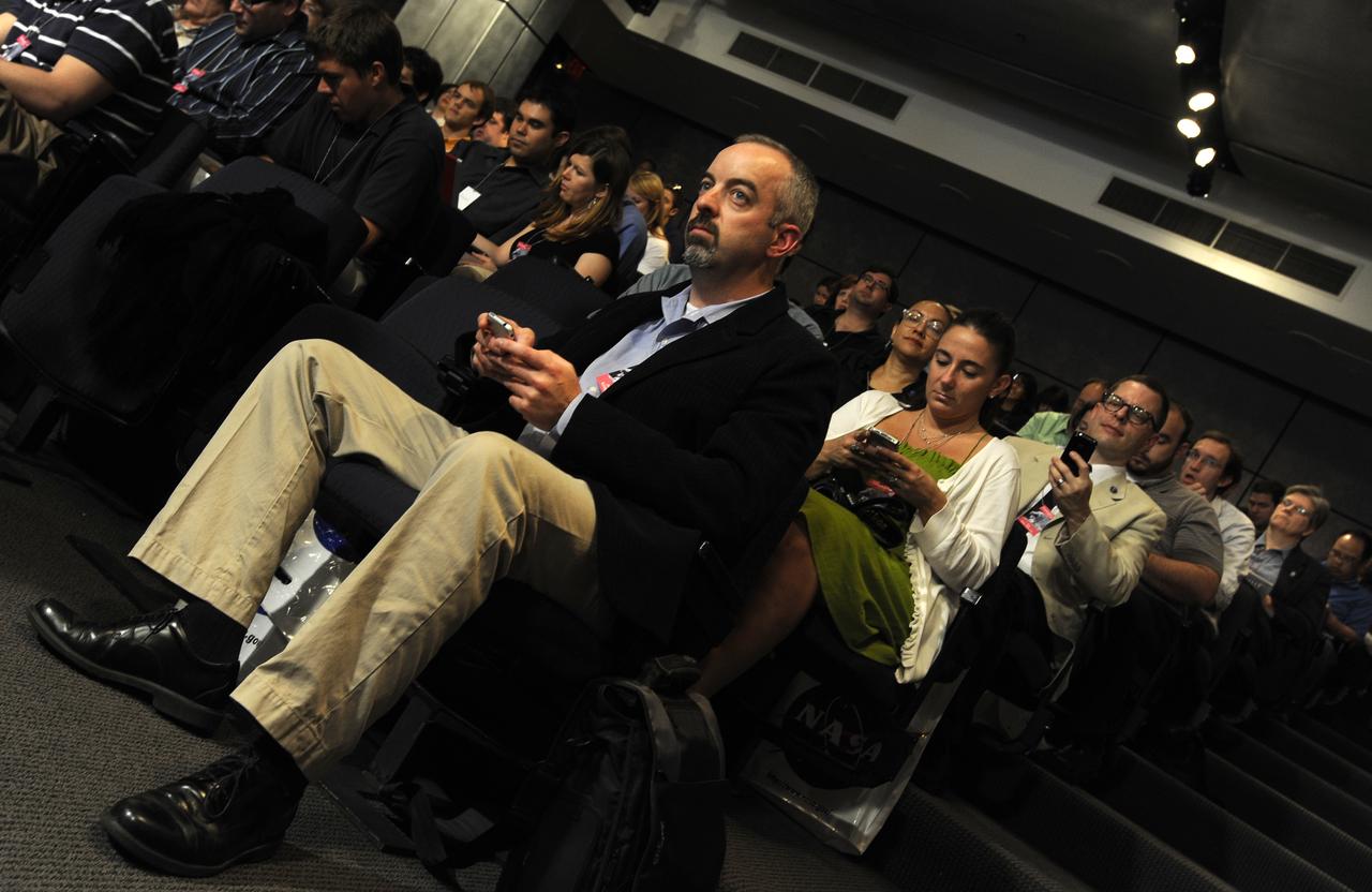Guests at NASA Headquarters in Washington, DC prepare for a Tweetup on July 21, 2009. Nearly 200 of NASA’s Twitter followers are in attendance, which features a presentation and a question and answer session with the crew of the STS-125 shuttle mission to repair the Hubble Space Telescope. Photo Credit: (Carla Cioffi)