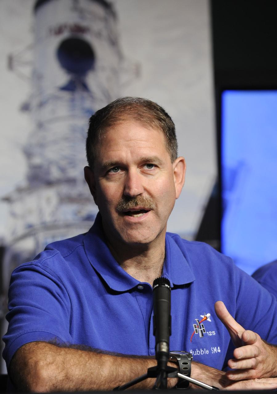 NASA Astronaut and STS-125 Mission Specialist John Grunsfeld answers a question during a presentation with fellow STS-125 shuttle mission crew members at the NASA Tweetup event held at NASA Headquarters, July 21, 2009 in Washington. Nearly 200 of NASA’s Twitter followers are in attendance.  Photo Credit: (Carla Cioffi)
