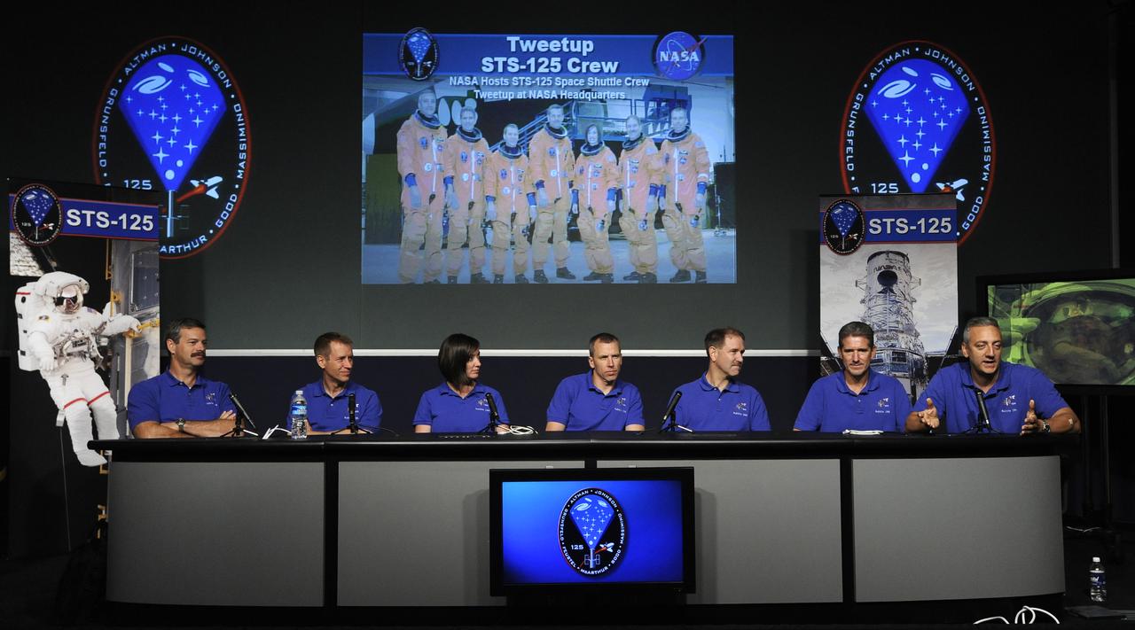 STS-125 shuttle mission crew members, from left, Scott Altman, Gregory Johnson, Megan McArthur, Andrew Feustel, John Grunsfeld, Michael Good and Michael Massimino, give a presentation at the NASA Tweetup event held at NASA Headquarters, July 21, 2009 in Washington. Nearly 200 of NASA's Twitter followers are in attendance, which featured a presentation and a question and answer session with the crew of the STS-125 shuttle mission to repair the Hubble Space Telescope. Photo Credit: (Carla Cioffi)