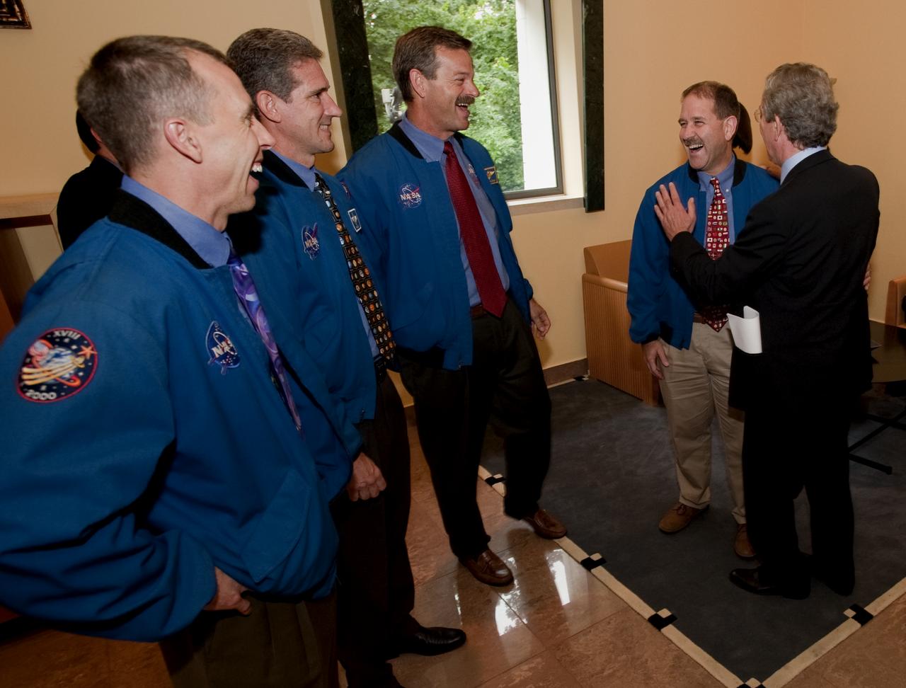 Members of the crew of STS-125, from left, Mission Specialists Andrew Feustel, Michael Good, Commander Scott Altman and Mission Specialist John Grunsfeld share a laugh with about the STS-125 mission to the Hubble Space Telescope during a visit by the crew to the Embassy of Italy in Washington, Thursday, July 23, 2009. Photo Credit: (NASA/Bill Ingalls)