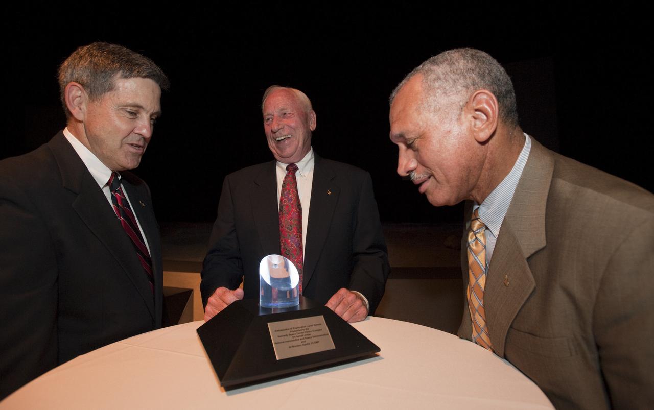 Apollo astronaut Al Worden, center, flanked by NASA Administrator Charles Bolden, right, and Kennedy Space Center Director Bob Cabana following a ceremony, Thursday, July 30, 2009, where Worden was honored with the presentation of the an Ambassador of Exploration Award for his contributions to the U.S. space program at Kennedy Space Center, Fla. Worden served as command module pilot for the Apollo 15 mission. Photo Credit: (NASA/Bill Ingalls)