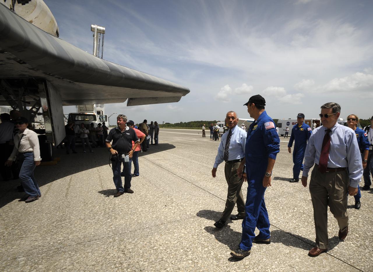 NASA Administrator Charles Bolden, left, STS-127 mission commander Mark Polansky, and NASA Kennedy Space Center Director Bob Cabana, right, walk around the space shuttle Endeavour shortly after it and its crew landed, Friday, July 31, 2009 at NASA's Kennedy Space Center in Cape Canaveral, Fla., completing a 16-day journey of more than 6.5 million miles. Endeavour delivered the final segment to the Japan Aerospace Exploration Agency's Kibo laboratory and a new crew member to the International Space Station. Photo Credit: (NASA/Bill Ingalls)