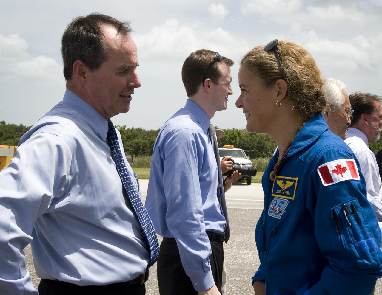 Benoit Marcotte, Director General of Canadian Space Agency Operations, left, welcomes home Canadian Space Agency's Julie Payette, right, shortly after the space shuttle Endeavour and its crew landed, Friday, July 31, 2009 at NASA's Kennedy Space Center in Cape Canaveral, Fla., completing a 16-day journey of more than 6.5 million miles. Endeavour delivered the final segment to the Japan Aerospace Exploration Agency's Kibo laboratory and a new crew member to the International Space Station.