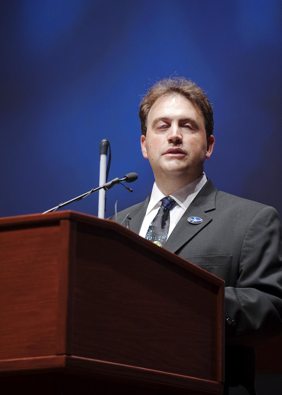 Mark Riccobono, executive director of the Jernigan Institute of the National Federation of the Blind speaks at a ceremony where senior NASA officials presented the NFB with two Louis Braille Bicentennial Silver Dollars that flew on Space Shuttle Atlantis' mission (STS-125) to the Hubble Space Telescope in May 2009, Friday evening, July 31, 2009, at the Capitol Visitors Center in Washington. Photo Credit: (NASA/Paul E. Alers)