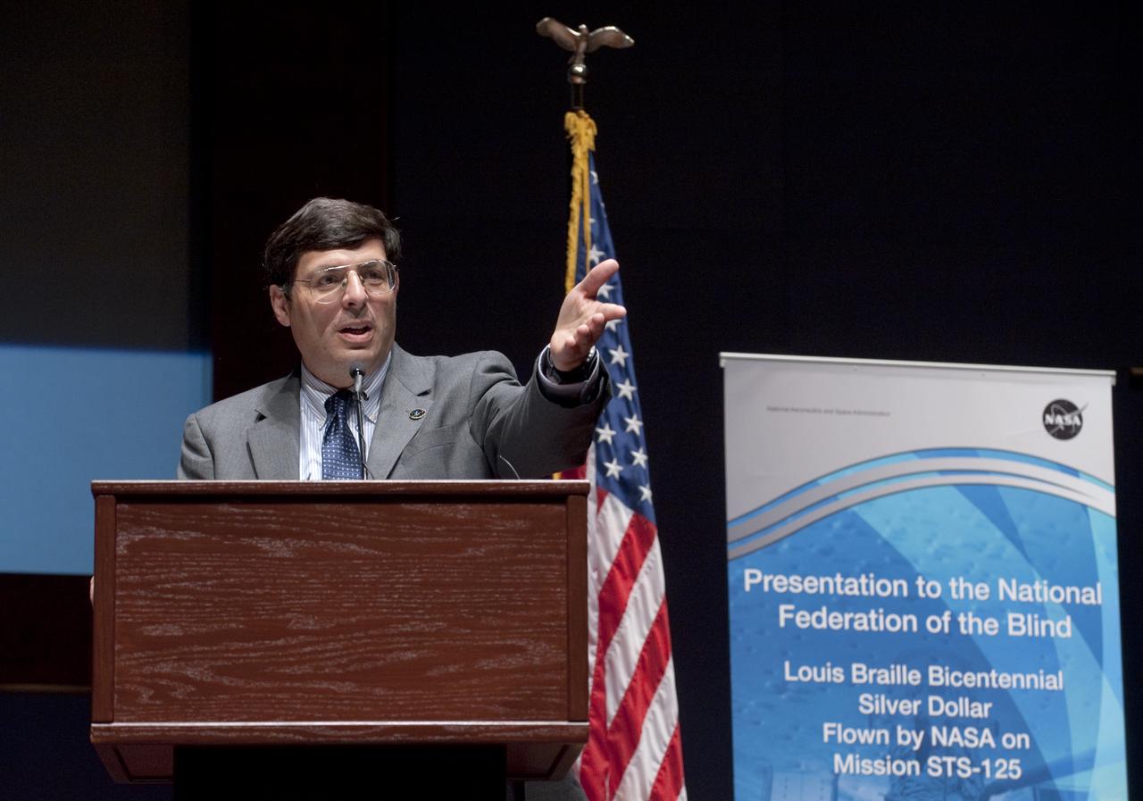 Chris Scolese, NASA Associate Administrator, speaks at a ceremony where senior NASA officials presented the National Federation of the Blind with two Louis Braille Bicentennial Silver Dollars that flew on Space Shuttle Atlantis' mission (STS-125) to the Hubble Space Telescope in May 2009, Friday evening, July 31, 2009, at the Capitol Visitors Center in Washington. Photo Credit: (NASA/Paul E. Alers)