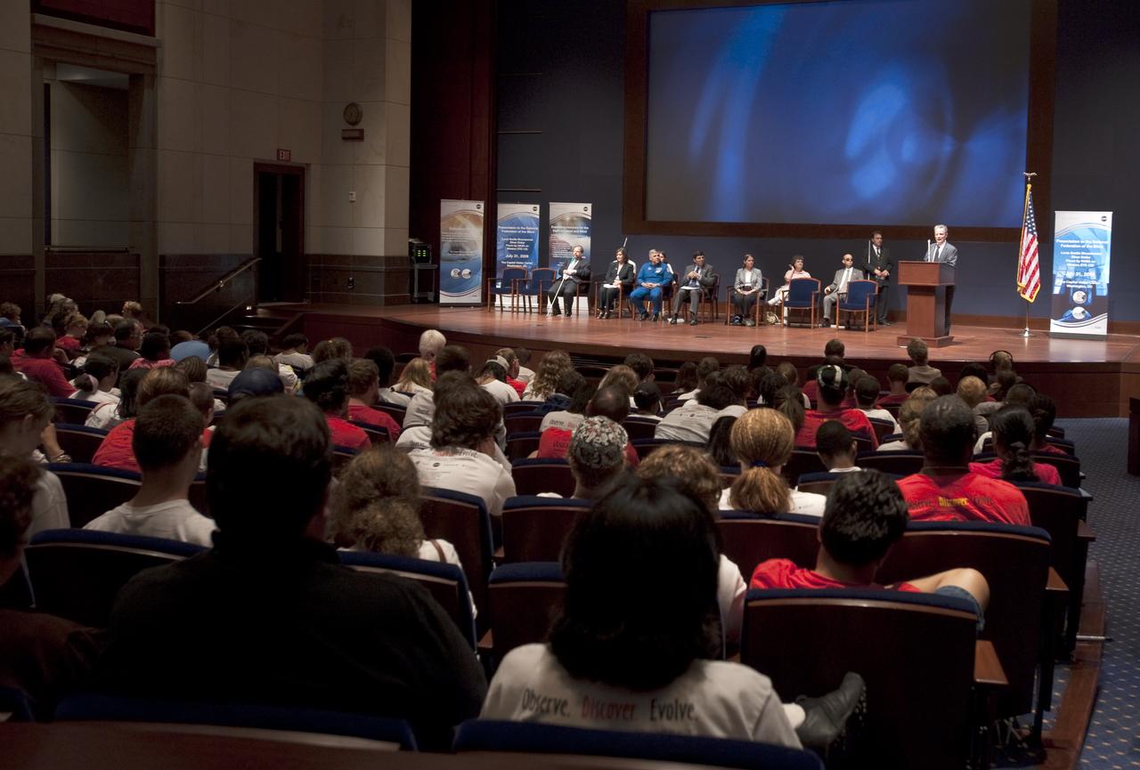 Dr. Marc Mauer, president of the National Federation of the Blind, at podium, speaks at a ceremony where senior NASA officials presented the NFB with two Louis Braille Bicentennial Silver Dollars that flew on Space Shuttle Atlantis' mission (STS-125) to the Hubble Space Telescope in May 2009, Friday evening, July 31, 2009, at the Capitol Visitors Center in Washington. Photo Credit: (NASA/Paul E. Alers)