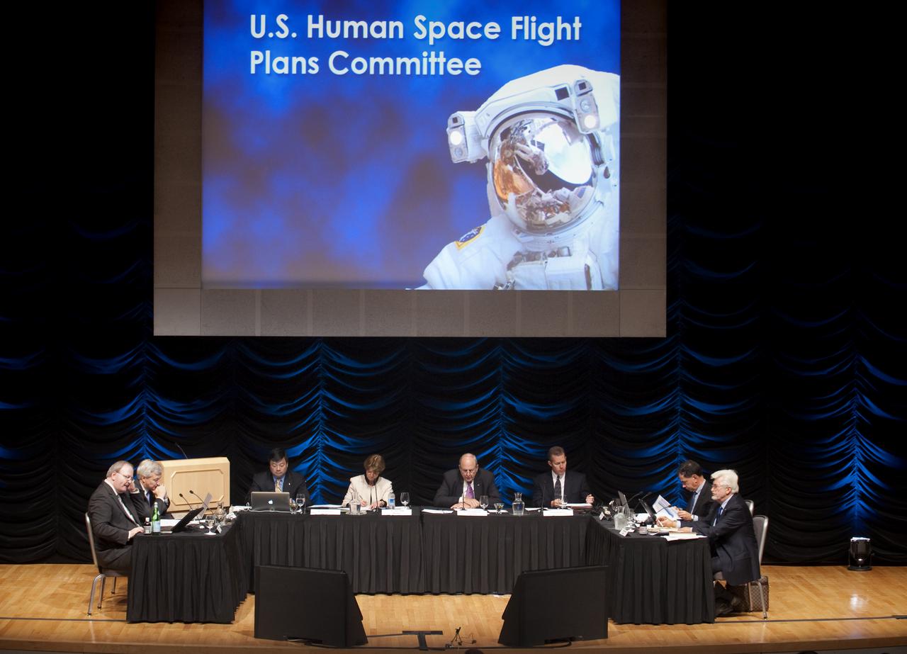 Members of the Human Space Flight Review Committee from left, Jeffrey Greason, Dr. Christopher Chyba, Dr. Leroy Chiao, Dr. Sally Ride, Norman Augustine (chair), Philip McAllister, Dr. Edward Crawley, Dr. Wanda Austin (not seen), and Bhodan Bejmuk review their notes prior to the start of a public meeting, Wednesday, Aug. 12, 2009, in Washington.  Photo Credit: (NASA/Paul E. Alers)