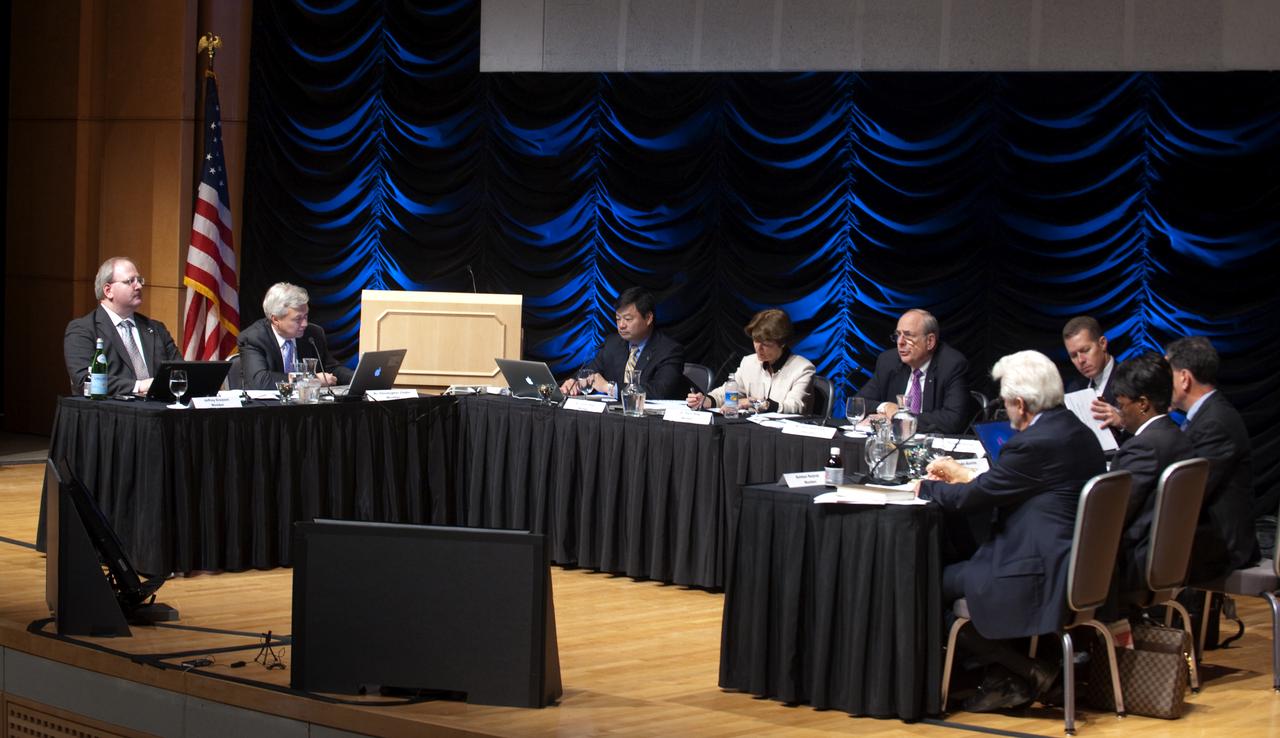 Members of the Human Space Flight Review Committee from left, Jeffrey Greason, Dr. Christopher Chyba, Dr. Leroy Chiao, Dr. Sally Ride, Norman Augustine (chair), Philip McAllister, Dr. Edward Crawley, Dr. Wanda Austin, and Bhodan Bejmuk review their notes prior to the start of a public meeting, Wednesday, Aug. 12, 2009, in Washington.  Photo Credit: (NASA/Paul E. Alers)