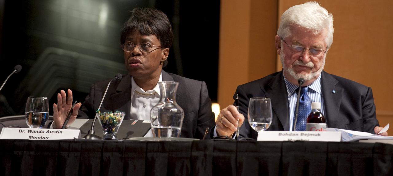 Dr. Wanda Austin, president and CEO of the Aerospace Corp., left, asks a question during the final meeting of the Human Space Flight Review Committee, Wednesday, Aug. 12, 2009, in Washington as committee member Bohdan Bejmuk reviews his notes.  Photo Credit: (NASA/Paul E. Alers)