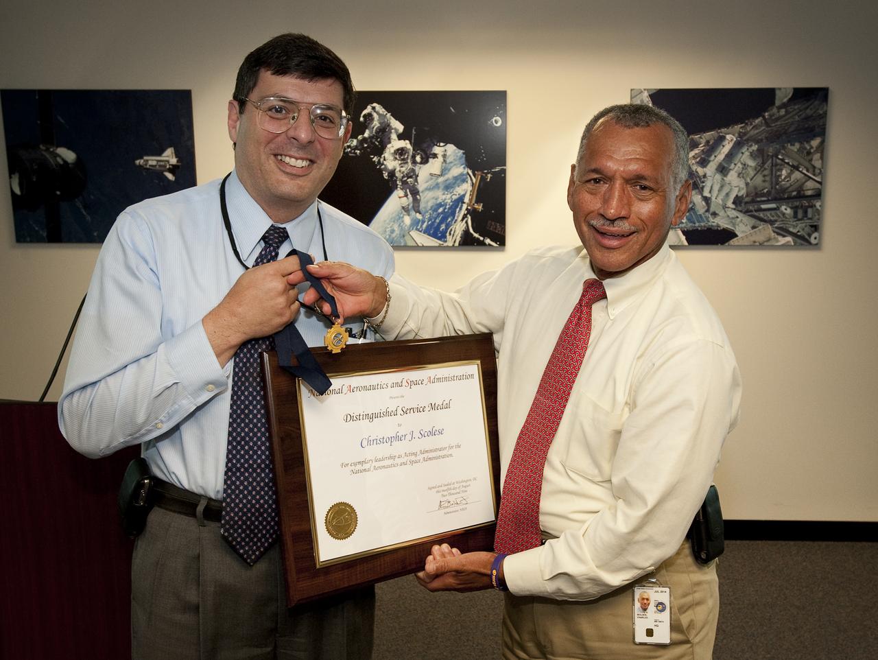 NASA Associate Administrator Christopher Scolese, left, receives the NASA Distinguished Service Medal from NASA Administrator Charles F. Bolden, Thursday, August 12, 2009 at NASA Headquarters in Washington.  Photo Credit: (NASA/Bill Ingalls)